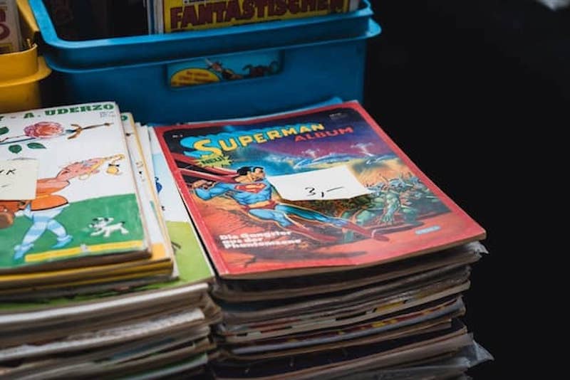 Second hand comic books in piles to sell